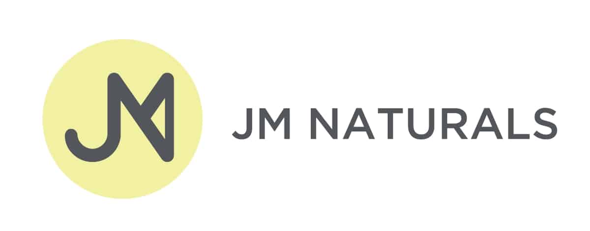 Logo of JM Naturals with capitalized dark gray sans sarif font and letters 'J' and 'M' combined together in a yellow circle